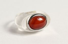 A RED STONE DESIGNER RING