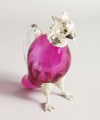 A SMALL CRANBERRY GLASS BIRD CLARET JUG with plated mounts.