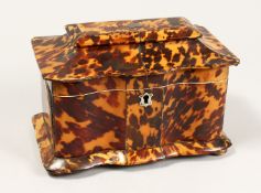A GOOD REGENCY BLOND TORTOISESHELL TWO DIVISION TEA CADDY on four bun feet. 7.5ins wide.