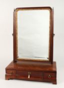 A GEORGIAN MAHOGANY TOILET MIRROR, gilded glass mirror, the base with three drawers on bracket