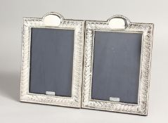 A PAIR OF SILVER BEAD EDGE PHOTOGRAPH FRAMES. 7.5ins x 5ins
