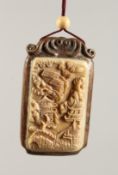 A CHINESE CARVED BONE AND WOOD PENDANT