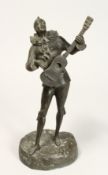 SIGINIERT MASORE A GOOD STANDING BRONZE OF A PIEROT playing a guitar. Signed, MASORE 13ins high.