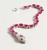 A SILVER RUBY SET SNAKE BRACELET.