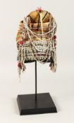 A PERUVIAN HEADRESS AND STAND