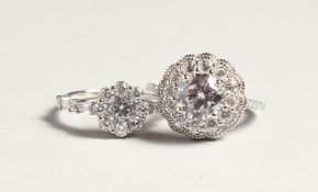 TWO SILVER AND ZIRCON CLUSTER RINGS
