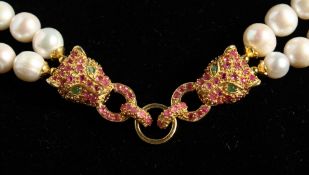 A SILVER AND GOLD PLATED PEARL PANTHER NECKLACE SET with rubies and emeralds.