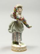 A GOOD MEISSEN PORCELAIN FIGURE OF A GIRL holding a garland of flowers, on a circular base. Cross