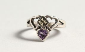 A SILVER CLADDAGH RING