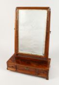 AN EARLY GEORGIAN MAHOGANY TOILET MIRROR, upright bevelled glass, the base with three drawers on