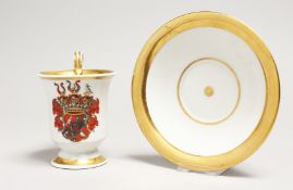 A BERLIN PORCELAIN CUP AND SAUCER, the cup with a crest. Blue septre mark.