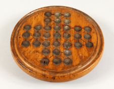 A CIRCULAR SOLITAIRE BOARD AND MARBLES 6.5ins diameter