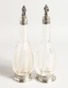 A VERY GOOD PAIR OF EUROPEAN SILVER MOUNTED ETCHED GLASS WINE AND WATER BOTTLES, the stoppers with