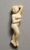 A CARVED BONE NUDE GIRL DOCTOR'S FIGURE 4ins long