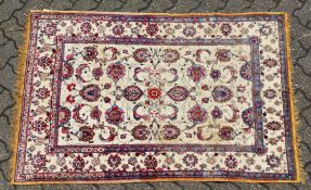 A GOOD SMALL SOUF KASHAN SILK RUG, beige ground with stylised palmettes, within a similar border.