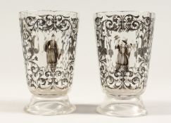 A GOOD PAIR OF BOHEMIAN GLASS TWELVE SIDED BEAKERS, painted with Turkish figures, scrolls and birch.