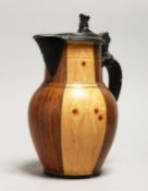 A CONTINENTAL FAUX BOIS WOOD GRAIN EWER with pewter lid. 9.5ins high