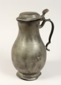 A FRENCH PEWTER LIDDED JUG 11ins high.