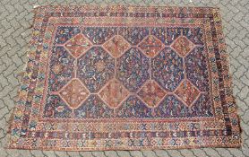 A GOOD PERSIAN CARPET with five large medallions, eight small medallions within a triple row border.
