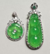 TWO DECORATED PENDANTS