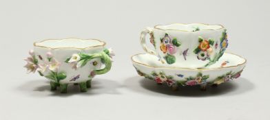 TWO MEISSEN PORCELAIN CUPS AND SAUCERS AND A SAUCER, encrusted with flowers and painted with
