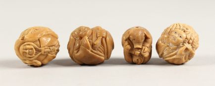 FOUR CARVED BONE NETSUKES
