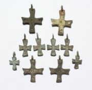 TEN SMALL METAL ROMAN CROSSES. 2-3ins long