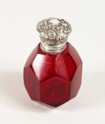 A FACET CUT RUBY GLASS SCENT BOTTLE with silver top.