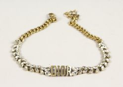 A DIOR PATTERN BRACELET in a 'Dior' bag.