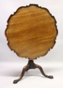 A CHIPPENDALE STYLE MAHOGANY TILT TOP TABLE with pie crust top, turned support, curving legs with