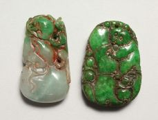 TWO CARVED STONE PENDANTS