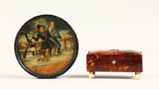 A SMALL TORTOISESHELL CASKET on ivory bun feet and a circular papier mache snuff box. 3ins (2)