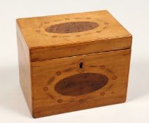 A SMALL GEORGE III RECTANGULAR TEA CADDY with inset ovals. 4.75ins