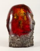 A LARGE RUSTIC PIECE OF AMBER 9.5ins high