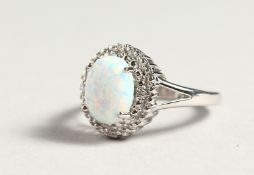A SILVER OPALITE AND DIAMOND CLUSTER RING