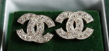 A PAIR OF 9CT GOLD CC ZIRCON SET EARRINGS.