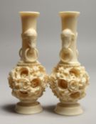 A PAIR OF FAUX IVORY PUZZLE VASES 6ins high.