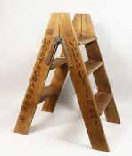 A BOLINGER - DOM PERIGNON FOLDING WOODEN STEPS