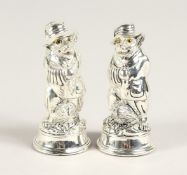 A PAIR OF SILVER PLATE FOX SALT AND PEPPERS