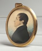 AN EARLY VICTORIAN OVAL MINIATURE OF A GENTLEMAN in a gilt frame. 2.25ins x 1.75ins