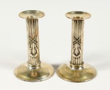 A PAIR OF POLO PRESENTATION CANDLESTICKS, 'To William Reddaway From The Delhi Polo Club', with cross