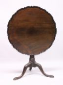 A CHIPPENDALE STYLE MAHOGANY TILT TOP TRIPOD TABLE with pie crust top, gun barrel support, curving