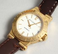 AN 18CT. GOLD BULGARI WRIST WATCH with leather strap, in original box.
