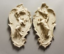 A PAIR OF NOUVEAU STYLE PLAQUES with classical figures 13ins long
