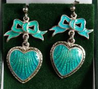 A PAIR OF SILVER AND ENAMEL BOW AND HEART EARRINGS