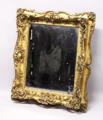 A GOOD VICTORIAN GILT FRAMED MIRROR. Mirrored panel 26ins x 22ins.
