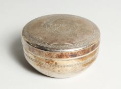 AN ISLAMIC SILVER CIRCULAR BOWL AND COVER. 3.75ins diameter.