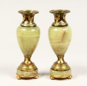 A GOOD SMALL PAIR OF FRENCH CHAMPAGNE ENAMEL AND ONYX VASES. 6.5ins high.