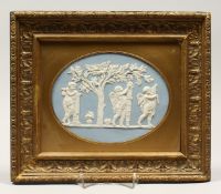 A WEDGWOOD BLUE AND WHITE GILT FRAMED PORCELAIN PLAQUE with cupids 6ins and 8ins.