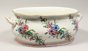 A LARGE VICTORIAN TWO HANDLED RECTANGULAR FOOT BATH painted with corn flowers . 19ins long 8ins